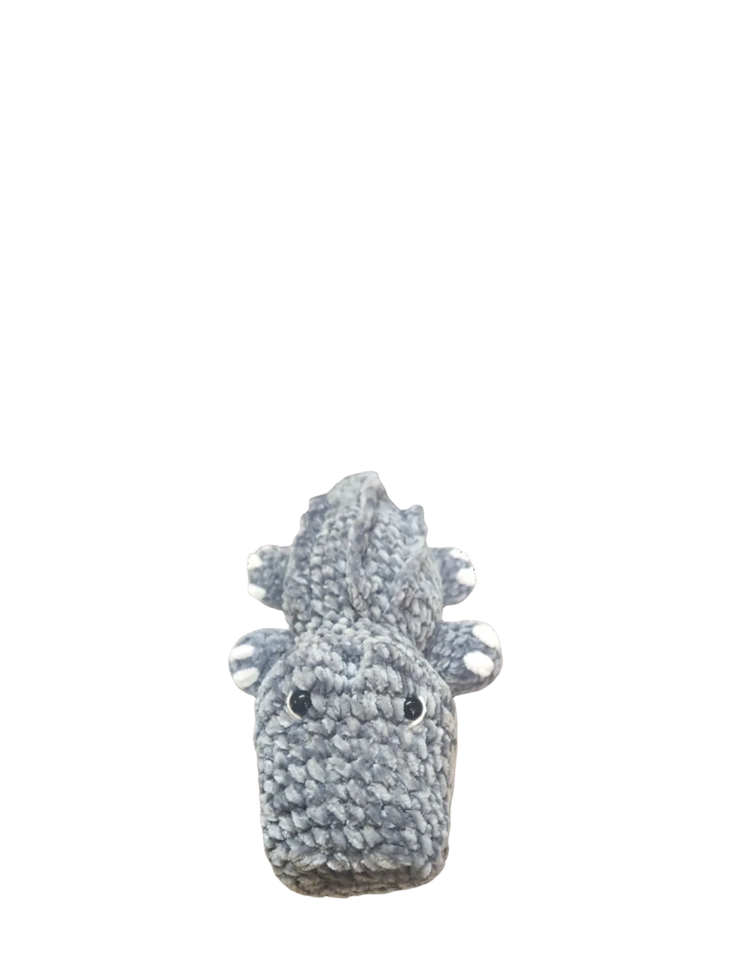 Suzie's Sunshine Dolls Kurtis the Croc, a handmade grey crocheted crocodile plush toy with white toes and stitched smile.