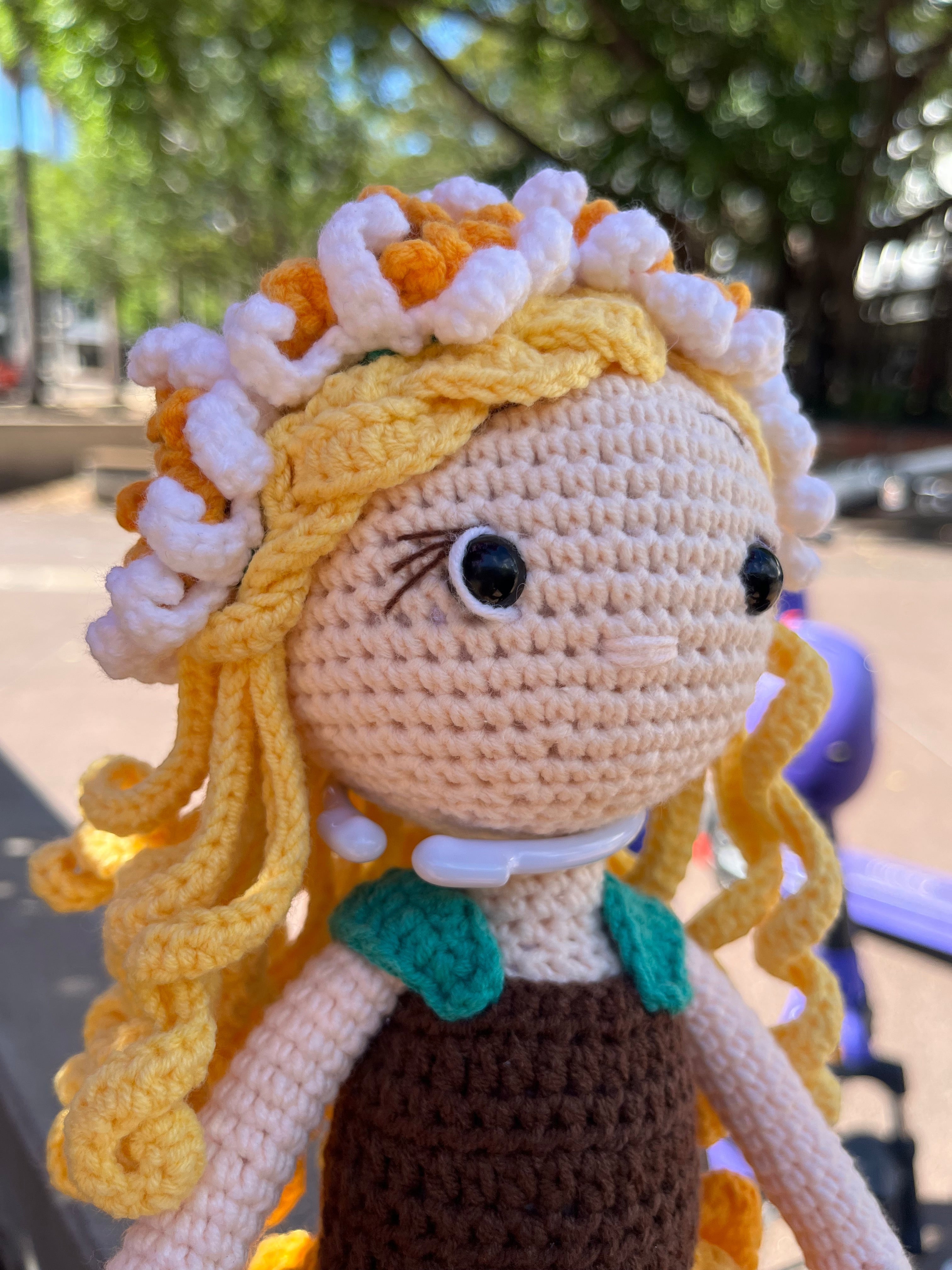 Suzie's Sunshine Dolls Daisy crochet doll with blonde yarn hair, sunflower skirt, and floral crown. Handmade.