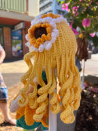 Suzie's Sunshine Dolls Daisy doll with yellow yarn hair, sunflower skirt, and floral crown. Handcrafted.
