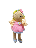 Suzie's Sunshine Dolls Delilah, a handmade crochet doll with blonde curls, pink dress, blue trim, and flower crown.
