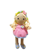 Suzie's Sunshine Dolls Delilah, a handmade crochet doll with blonde curls, pink dress, blue trim, and flower crown.