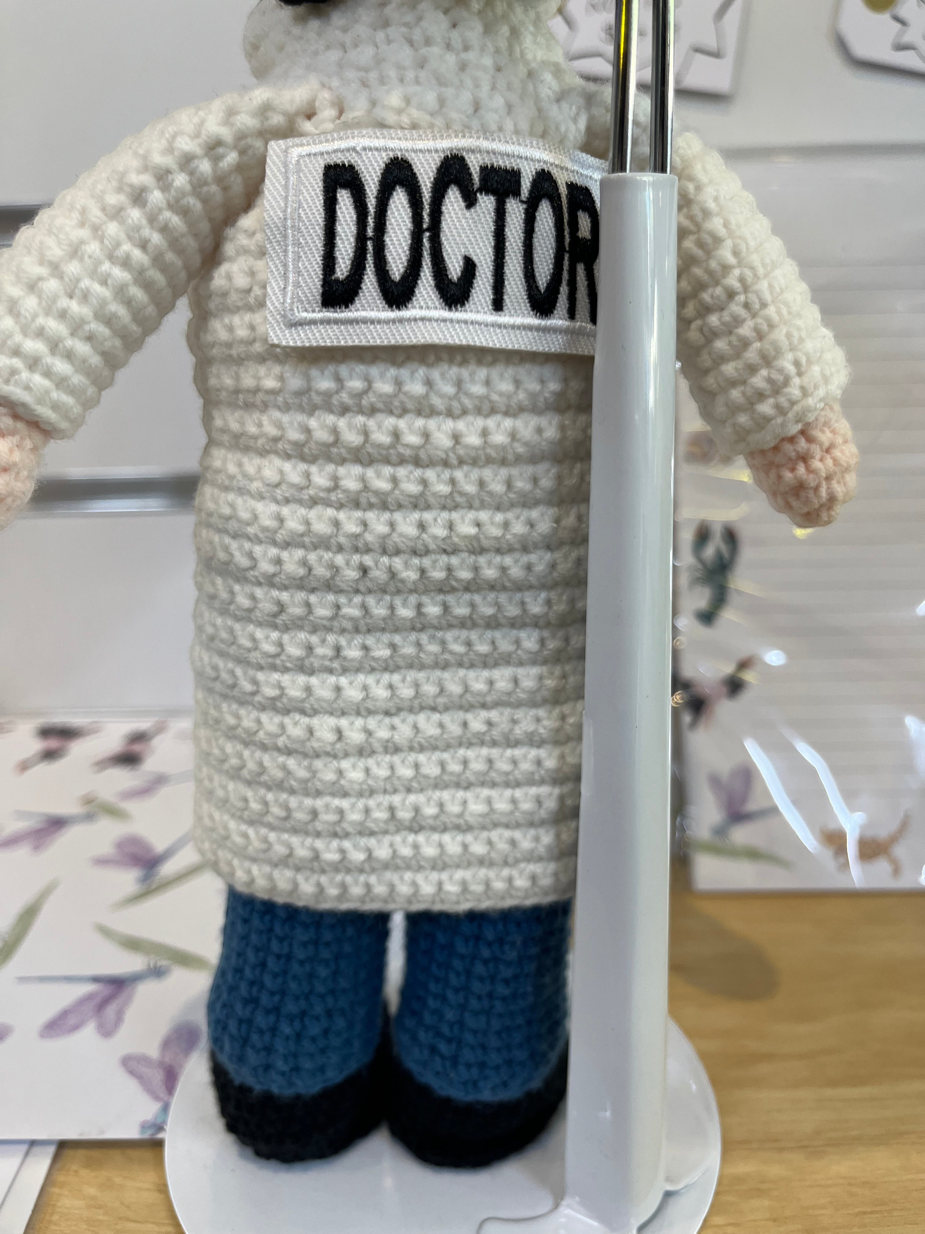 Suzie's Sunshine Dolls Doctor doll, crochet, white coat with "DOCTOR" patch, blue pants, black shoes.