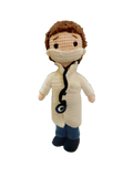 Suzie's Sunshine Dolls Doctor Doll, a crochet toy wearing a white coat, blue pants, and face mask with a stethoscope.