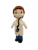 Suzie's Sunshine Dolls Doctor Doll, a crochet toy wearing a white coat, blue pants, and face mask with a stethoscope.