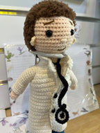 Suzie's Sunshine Dolls Doctor Doll, a crochet toy with white coat, stethoscope, and mask. Handmade in Australia.
