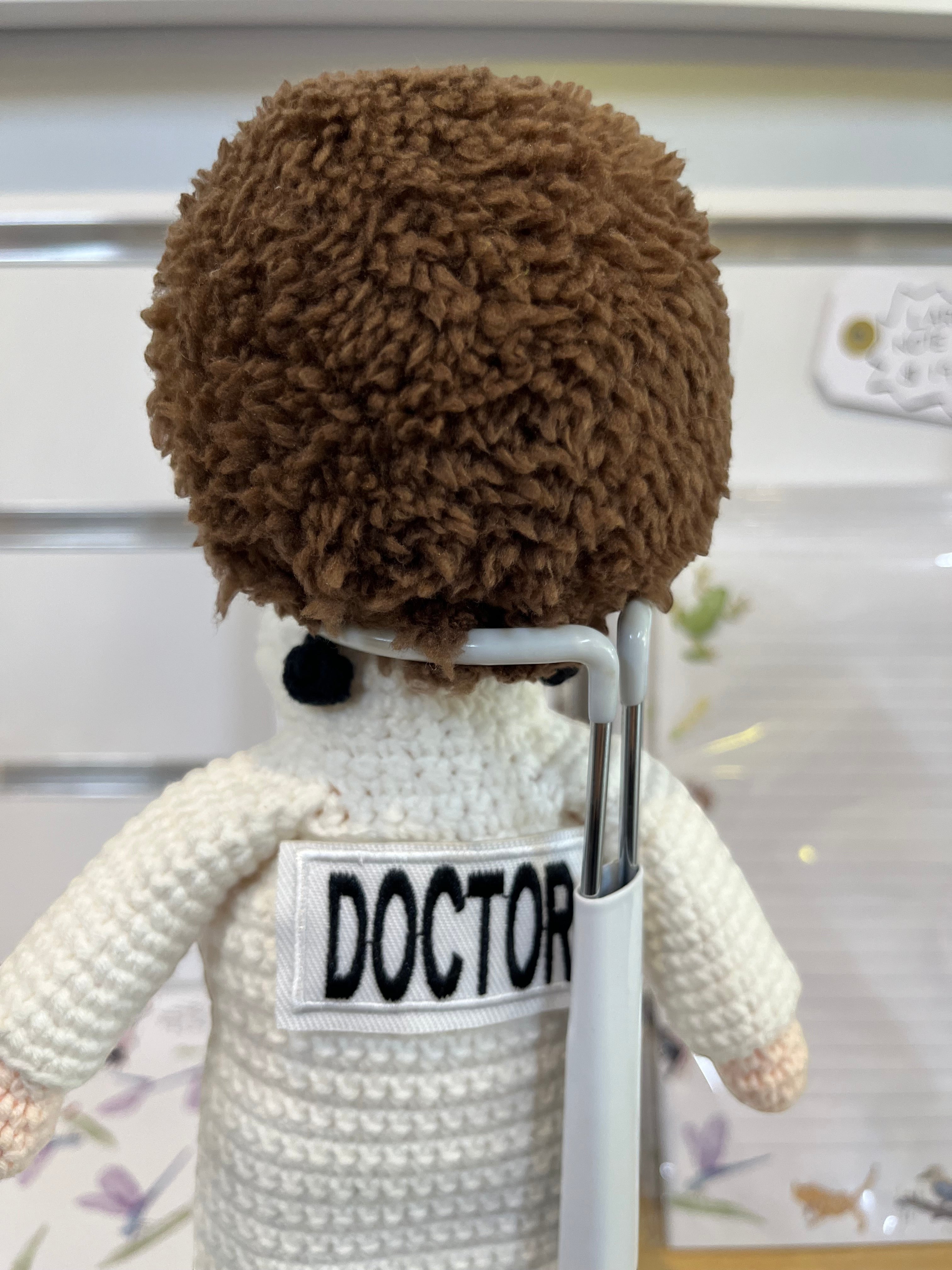 Suzie's Sunshine Dolls Doctor doll, handmade crochet, white coat, blue pants, stethoscope, face mask, brown hair.