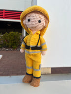 Suzie's Sunshine Dolls handmade crocheted yellow firefighter doll with reflective stripes and brown boots.