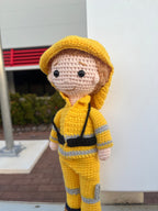 Suzie's Sunshine Dolls handmade yellow crocheted fireman doll with reflective stripes and hood. Approx. 28-30cm tall.