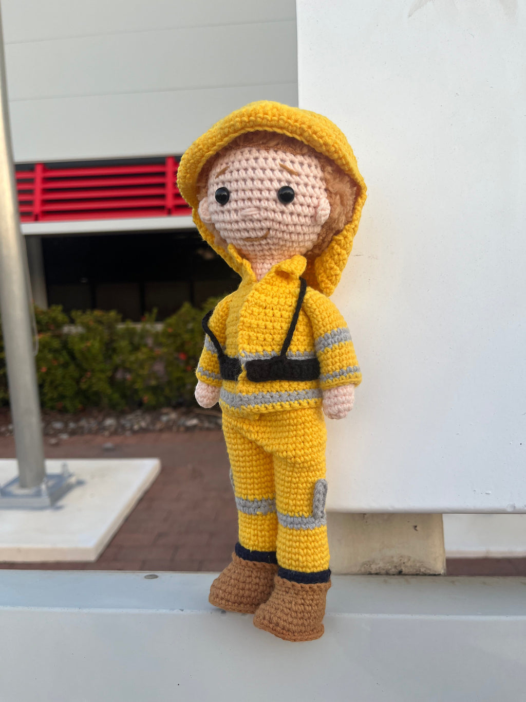 Suzie's Sunshine Dolls handmade yellow crocheted fireman doll with reflective stripes and brown boots. Approx. 28-30cm tall.