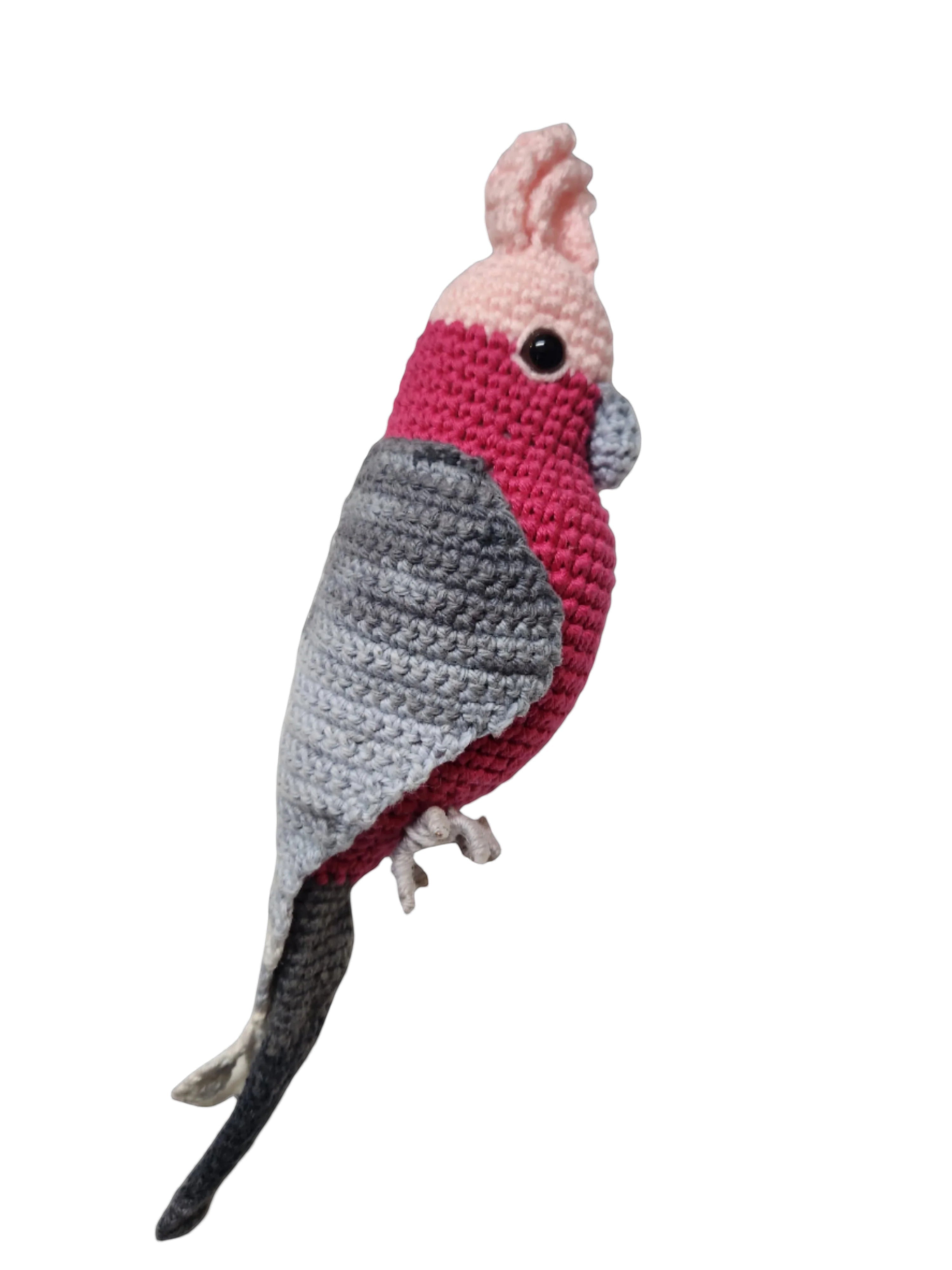 Suzie's Sunshine Dolls Galah crocheted bird with pink crest, grey and pink body, and wire feet.