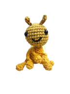 Suzie's Sunshine Dolls Gertrude the Green Ant crochet toy, golden-green yarn body, black eyes, stitched smile, antennae, approx. 10-12cm tall.