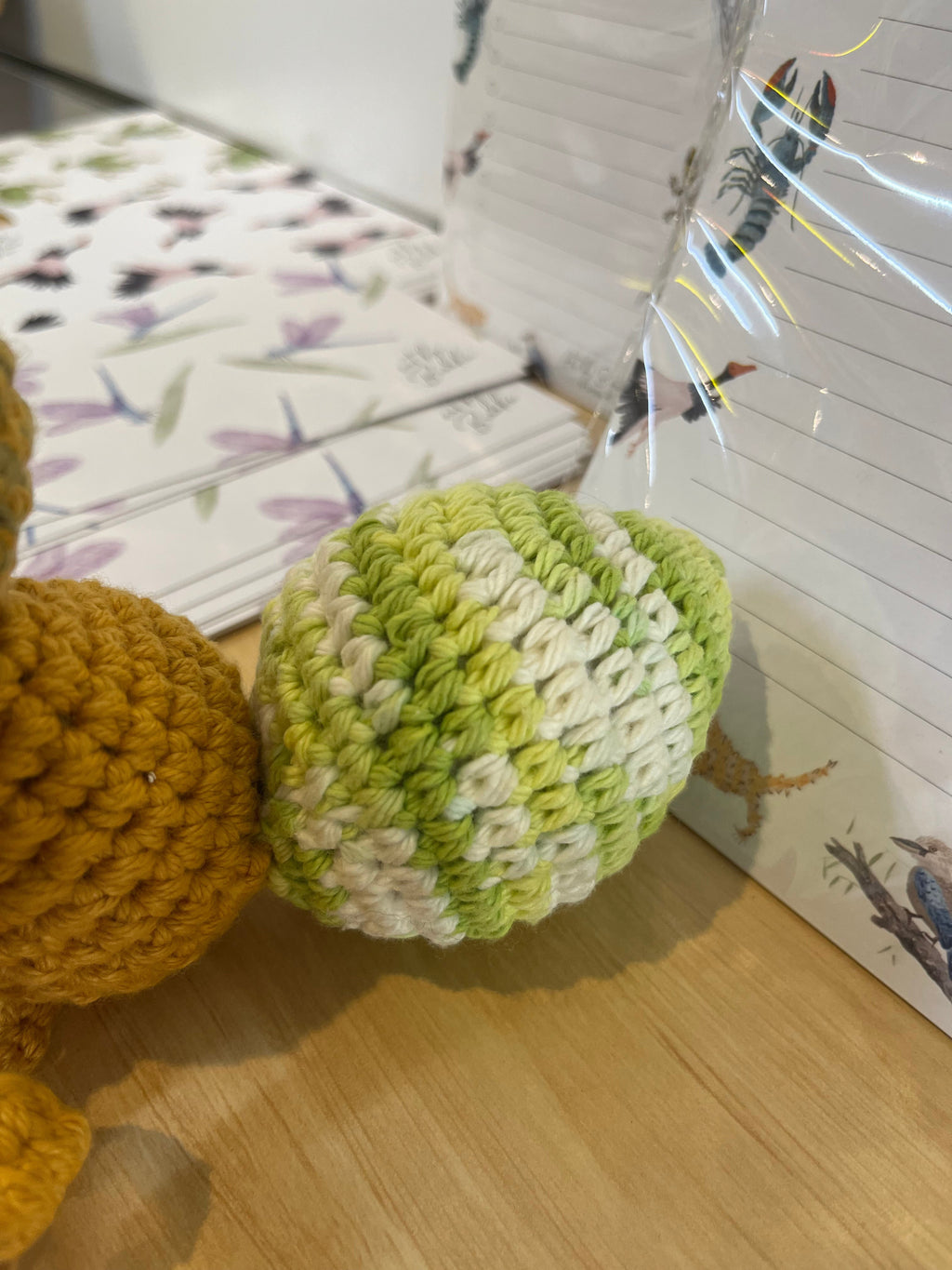 Suzie's Sunshine Dolls Gertrude the Green Ant crochet toy, featuring a yellow-green body and white yarn.