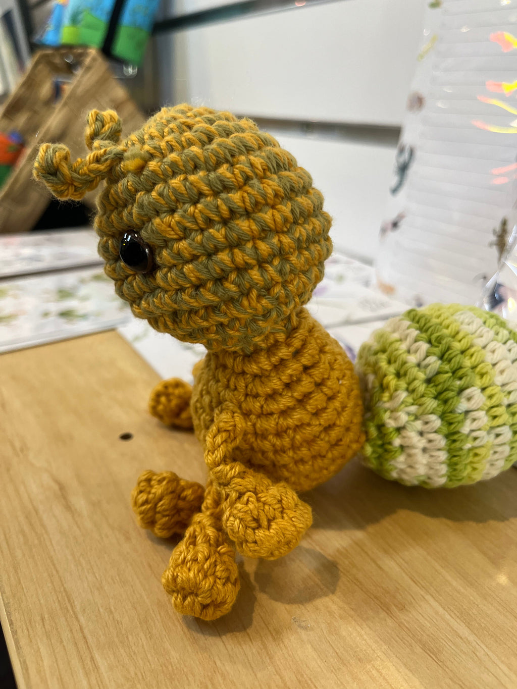 Suzie's Sunshine Dolls Gertrude the Green Ant crochet toy, yellow-green yarn, stitched smile, antennae, 10-12cm tall