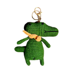 Suzie's Sunshine Dolls green crochet alligator keychain with orange scarf and gold keyring.