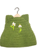 Suzie's Sunshine Dolls green crochet doll dress with embroidered white daisies and yellow centers, handmade yarn.