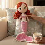Suzie's Sunshine Dolls handmade crochet mermaid doll with red hair, pink tail, and white trim. Approx. 28-30cm.