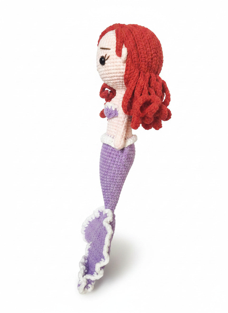 Suzie's Sunshine Dolls handmade crochet mermaid doll with red yarn hair, purple tail, and white trim. Approx. 28-30cm.