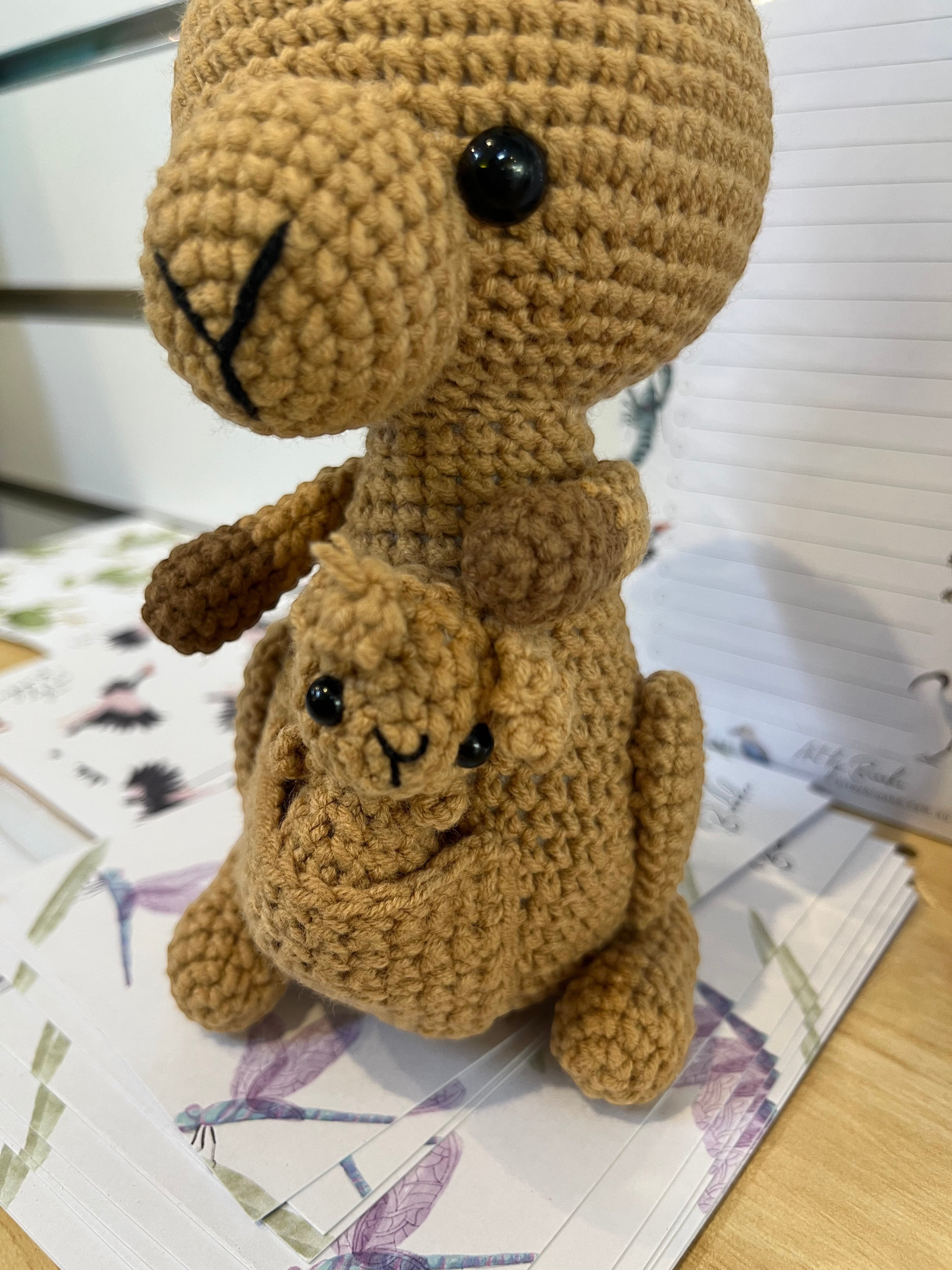 Suzie's Sunshine Dolls Kirsty the Kangaroo handmade crochet toy with joey in pouch, brown yarn, black eyes.