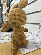 Suzie's Sunshine Dolls Kirsty the Kangaroo, a handmade brown yarn plush toy with joey in pouch. Approx 22-25cm.