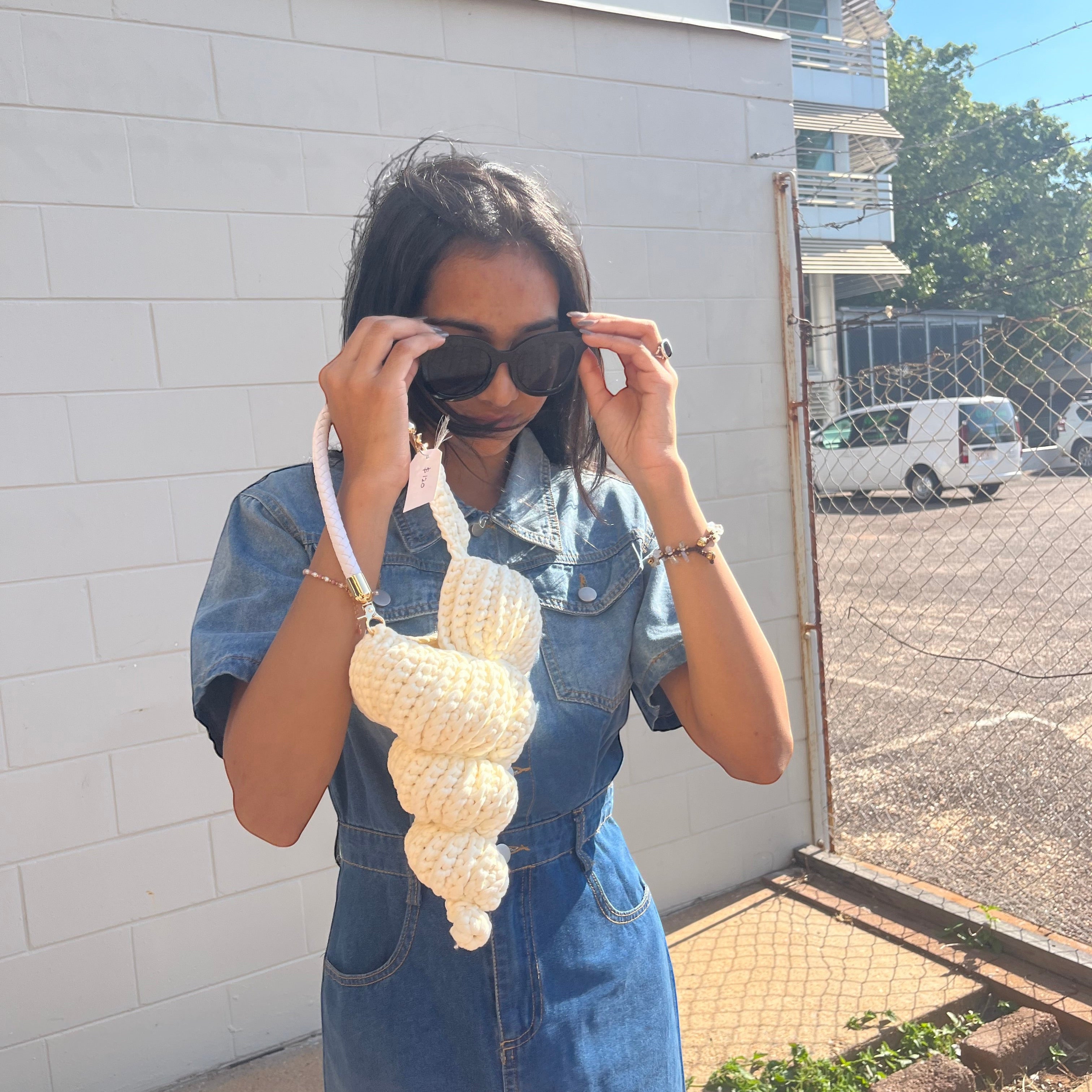 Suzie's Sunshine Dolls cream crocheted seashell handbag with braided rope handle.