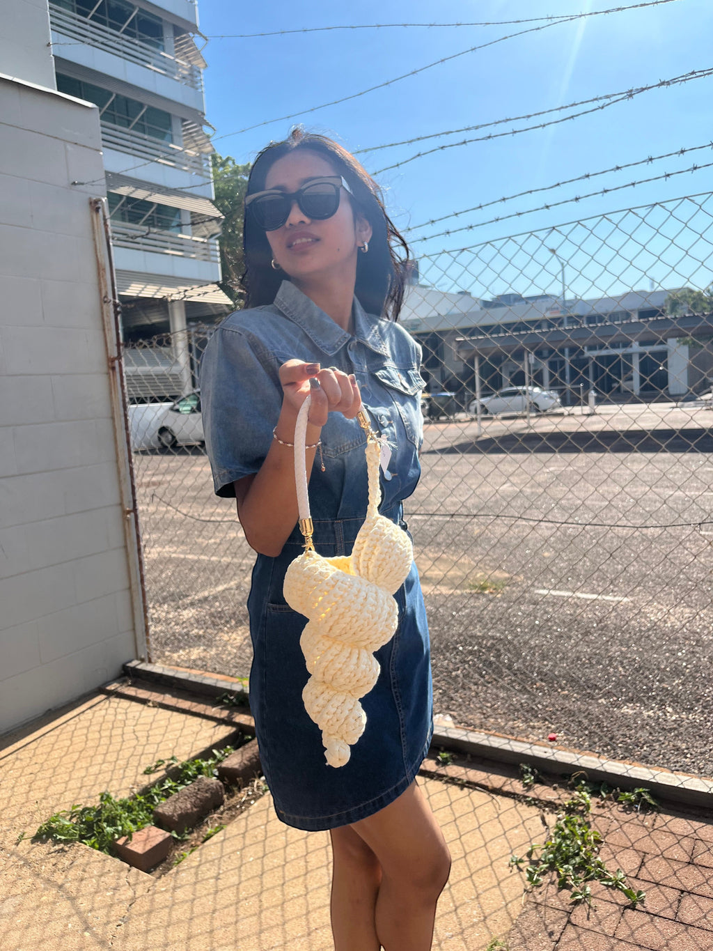 Suzie's Sunshine Dolls cream crocheted seashell handbag with braided rope handle.