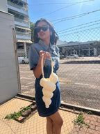 Suzie's Sunshine Dolls cream crocheted seashell handbag with braided rope handle.