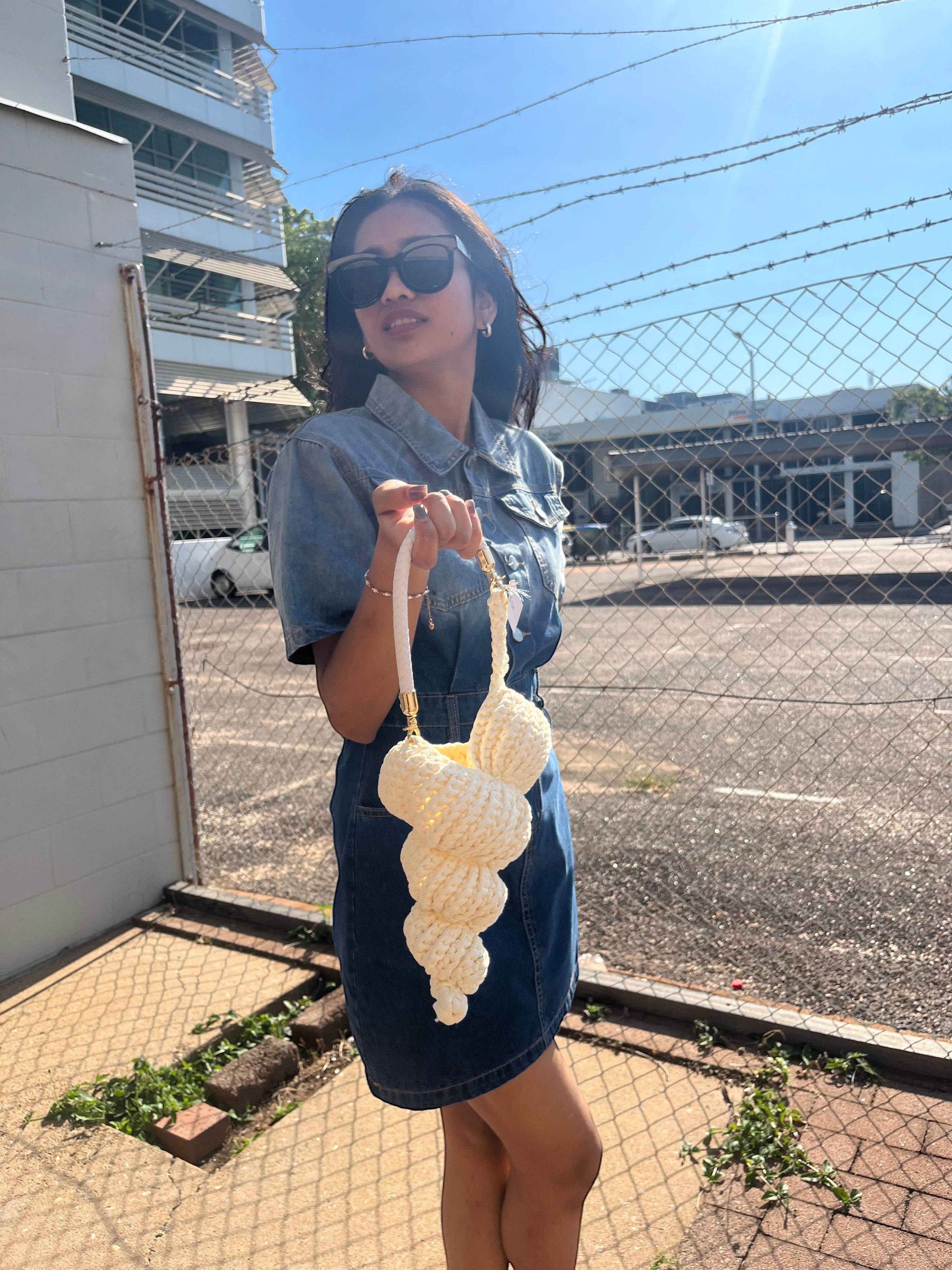 Suzie's Sunshine Dolls cream crocheted seashell handbag with braided rope handle.