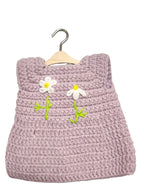 Suzie's Sunshine Dolls handmade lavender crochet doll dress with white daisy appliques and green stems.