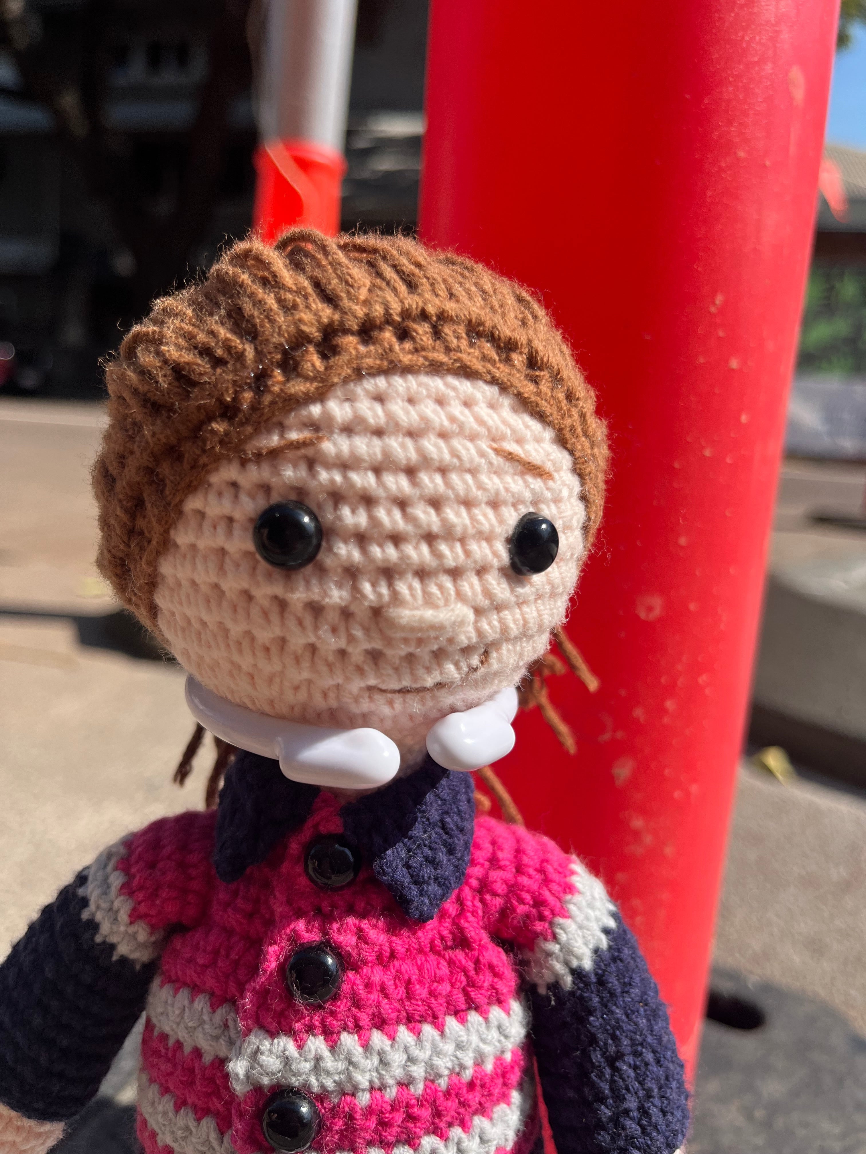 Suzie's Sunshine Dolls Miner/Tradie doll in pink hi-vis, navy pants, and stitched boots. Handmade crochet.