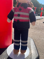 Suzie's Sunshine Dolls Miner/Tradie doll in pink hi-vis, navy pants, and brown boots. Hand-crocheted with reflective stripes.