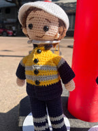 Suzie's Sunshine Dolls Miner/Tradie doll in yellow hi-vis jacket, navy pants, and white cap. Handmade crochet.