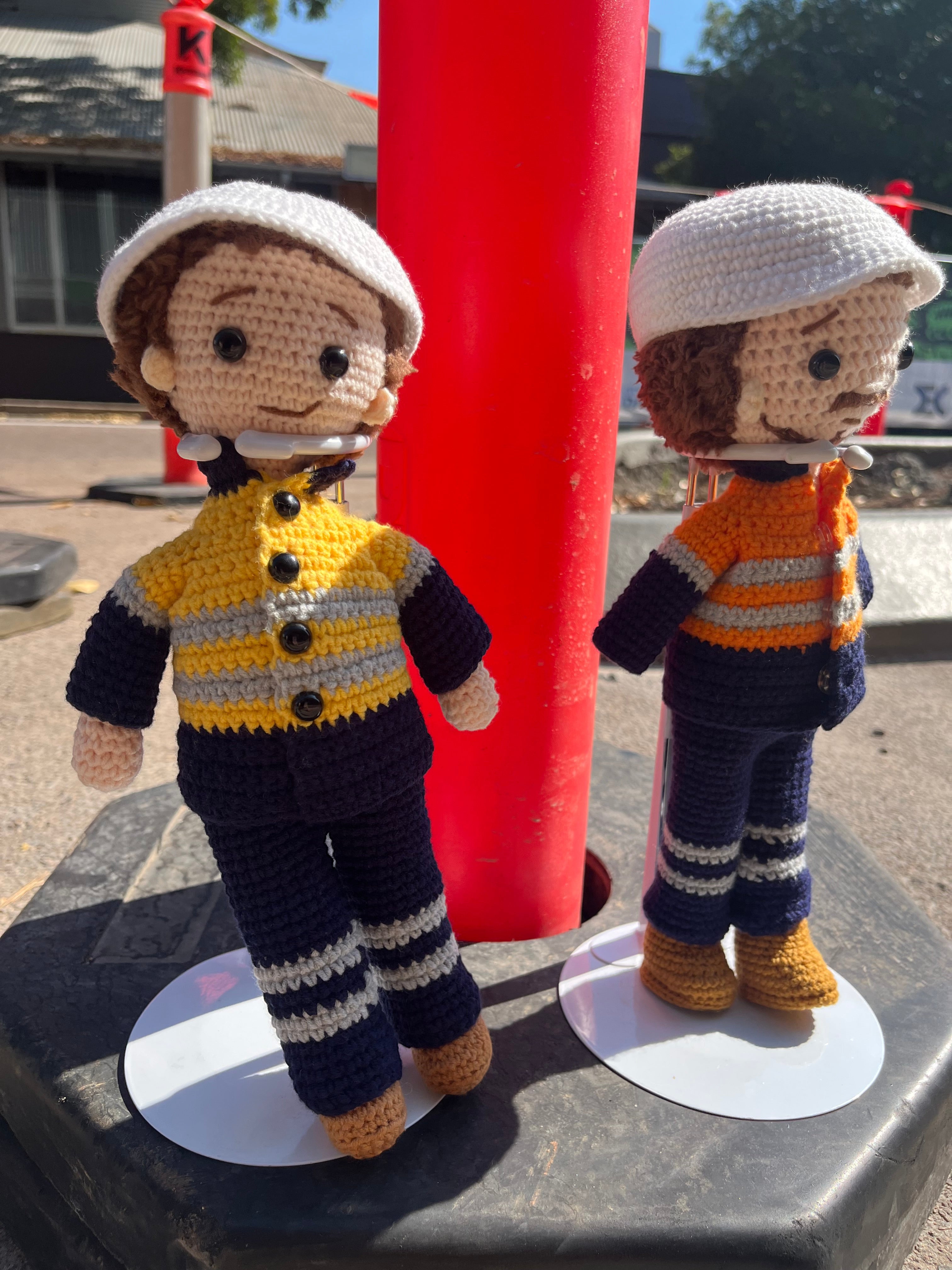 Suzie's Sunshine Dolls Miner/Tradie doll in yellow hi-vis, navy pants, and boots. Handmade crochet toy.