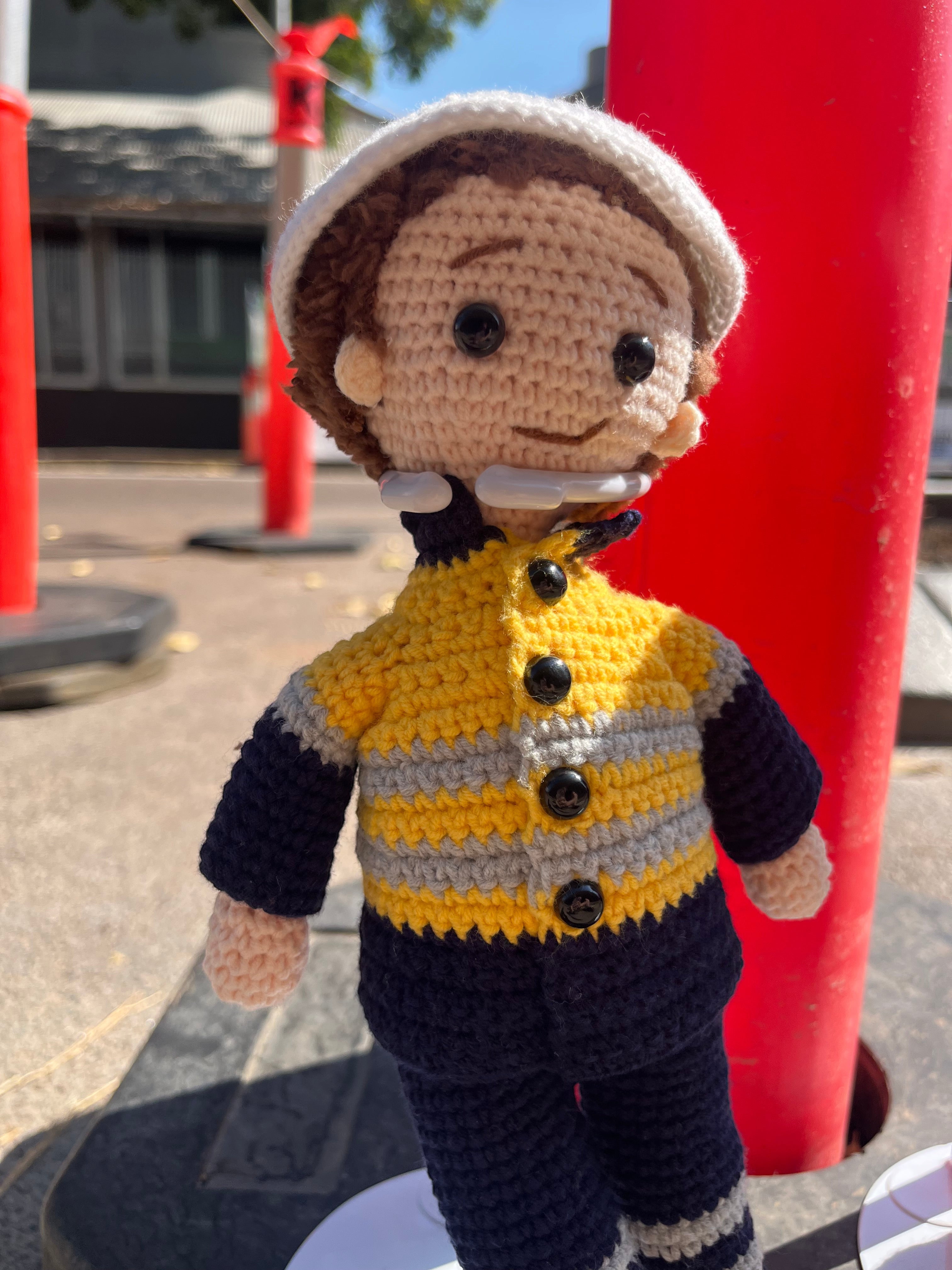 Suzie's Sunshine Dolls Miner/Tradie doll in yellow hi-vis jacket and navy pants, crocheted by hand.