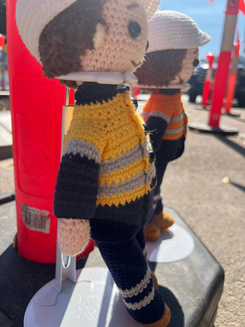 Suzie's Sunshine Dolls Miner/Tradie doll in yellow hi-vis jacket, navy pants, and white hard hat.