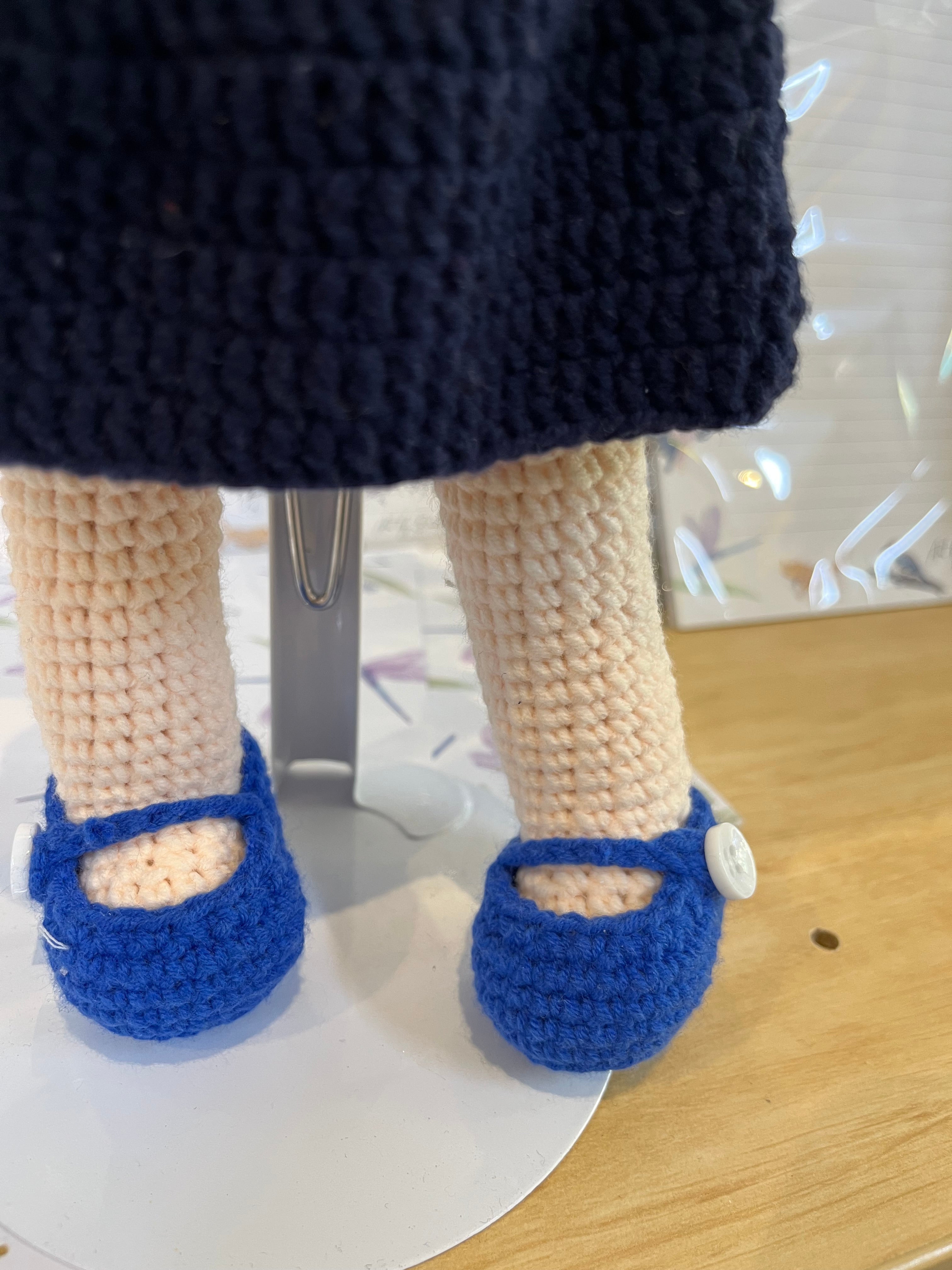 Suzie's Sunshine Dolls navy crocheted dress doll with blue shoes and Cancer Council NT patch. Educational toy.