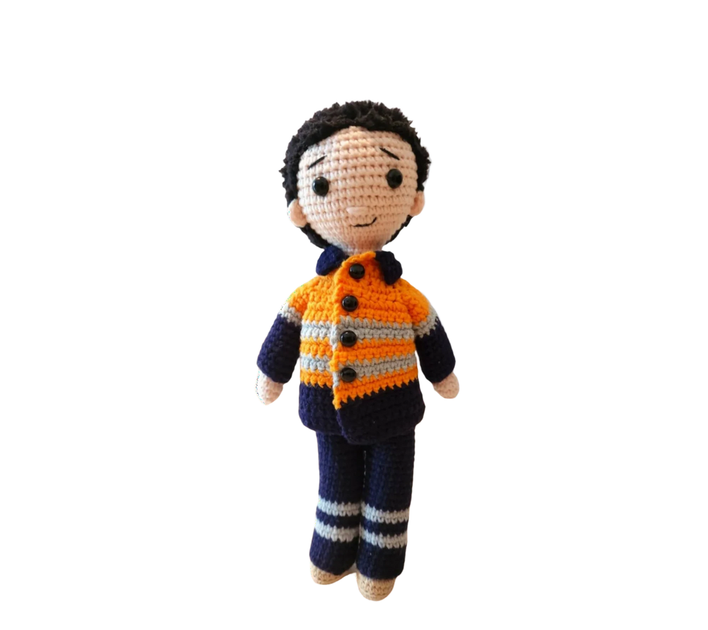 Suzie's Sunshine Dolls Orange Hi-Vis Miner/Tradie doll, crocheted with orange, navy, and grey stripes.