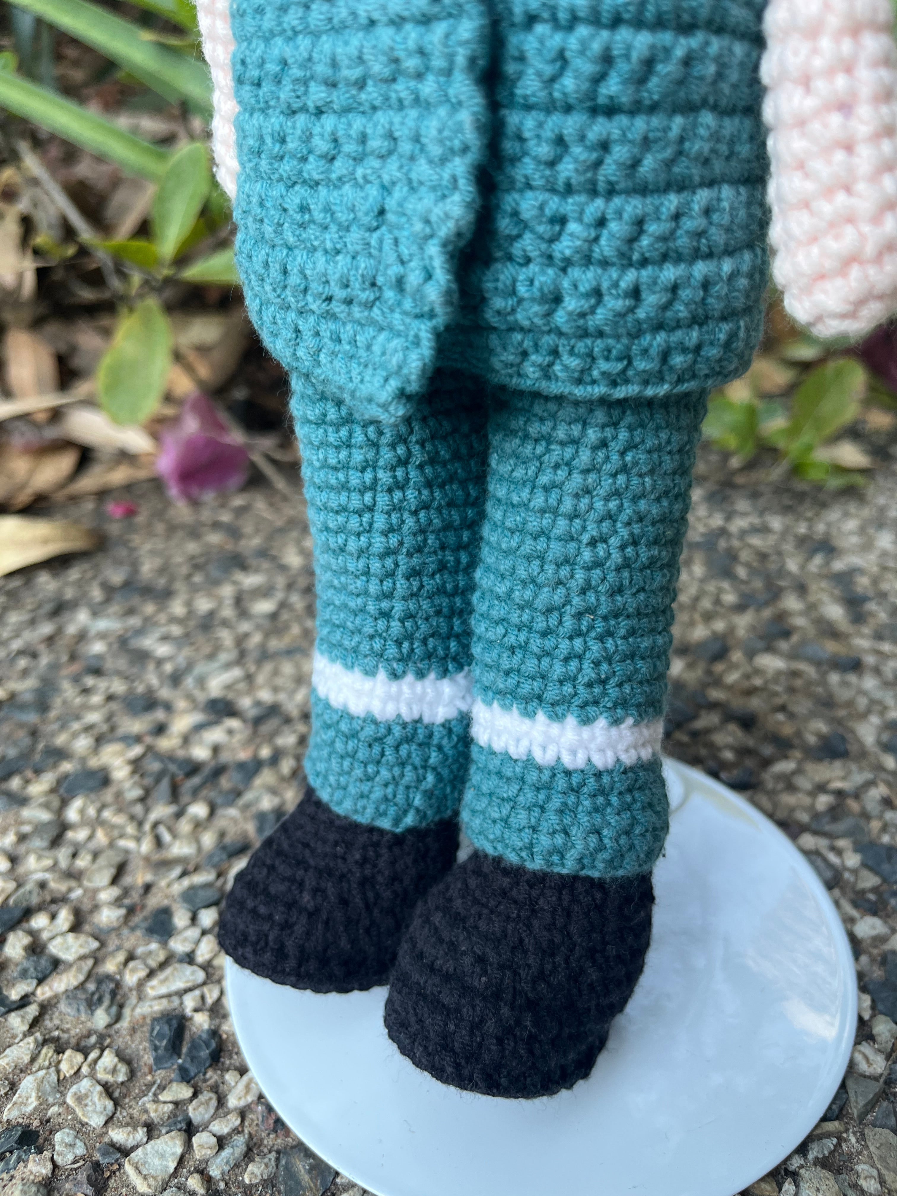 Suzie's Sunshine Dolls Paramedic doll in a green uniform with white stripes and black shoes, handmade from crochet yarn.