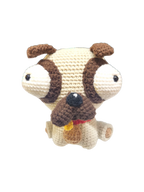 Suzie's Sunshine Dolls Pig the Pug crochet toy with big eyes, brown ears, and tongue out.