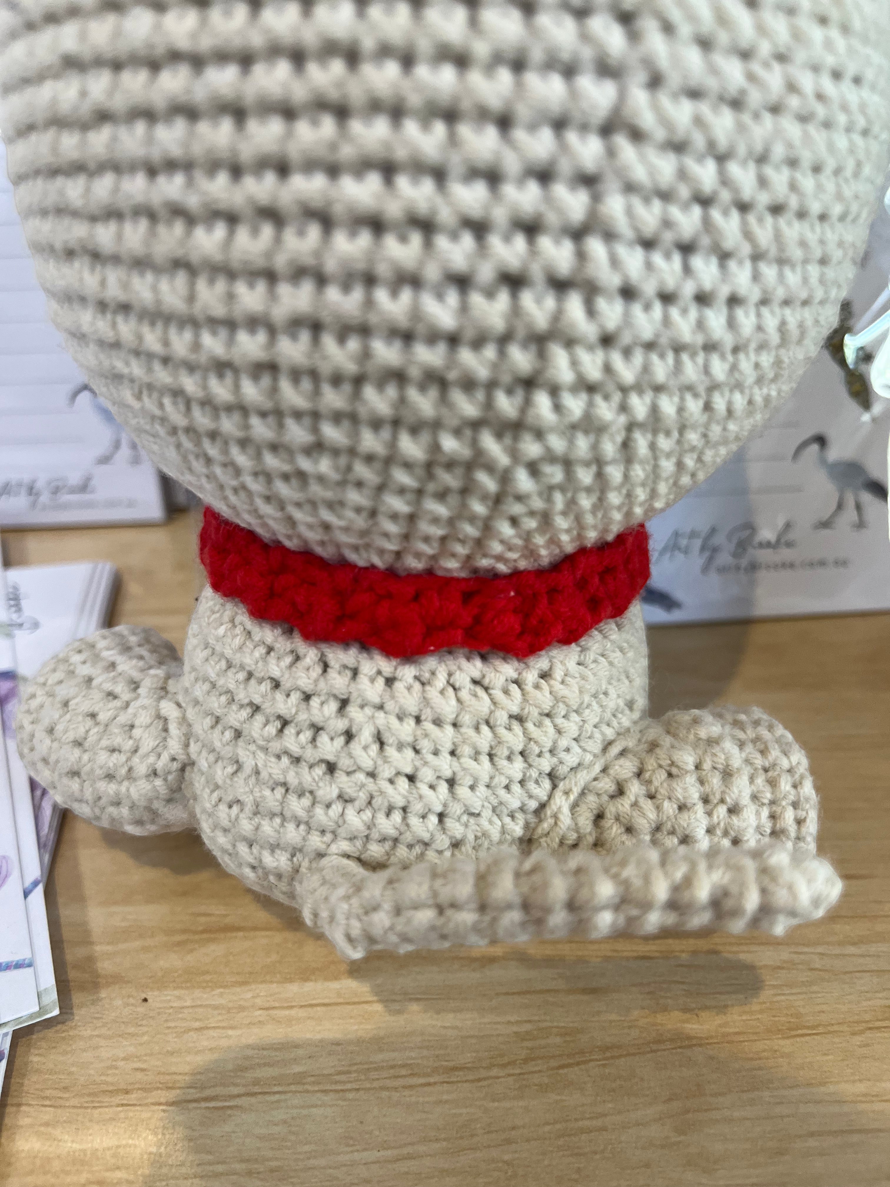 Suzie's Sunshine Dolls Pig the Pug crochet toy with red collar and beige yarn body.