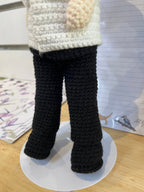 Suzie's Sunshine Dolls handmade crochet pilot doll in white shirt and black pants, perfect for role play.