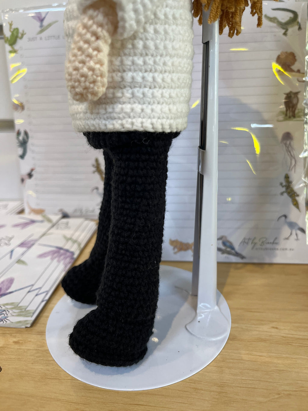 Suzie's Sunshine Dolls handmade crochet pilot doll in white shirt and black pants, ready for adventure.