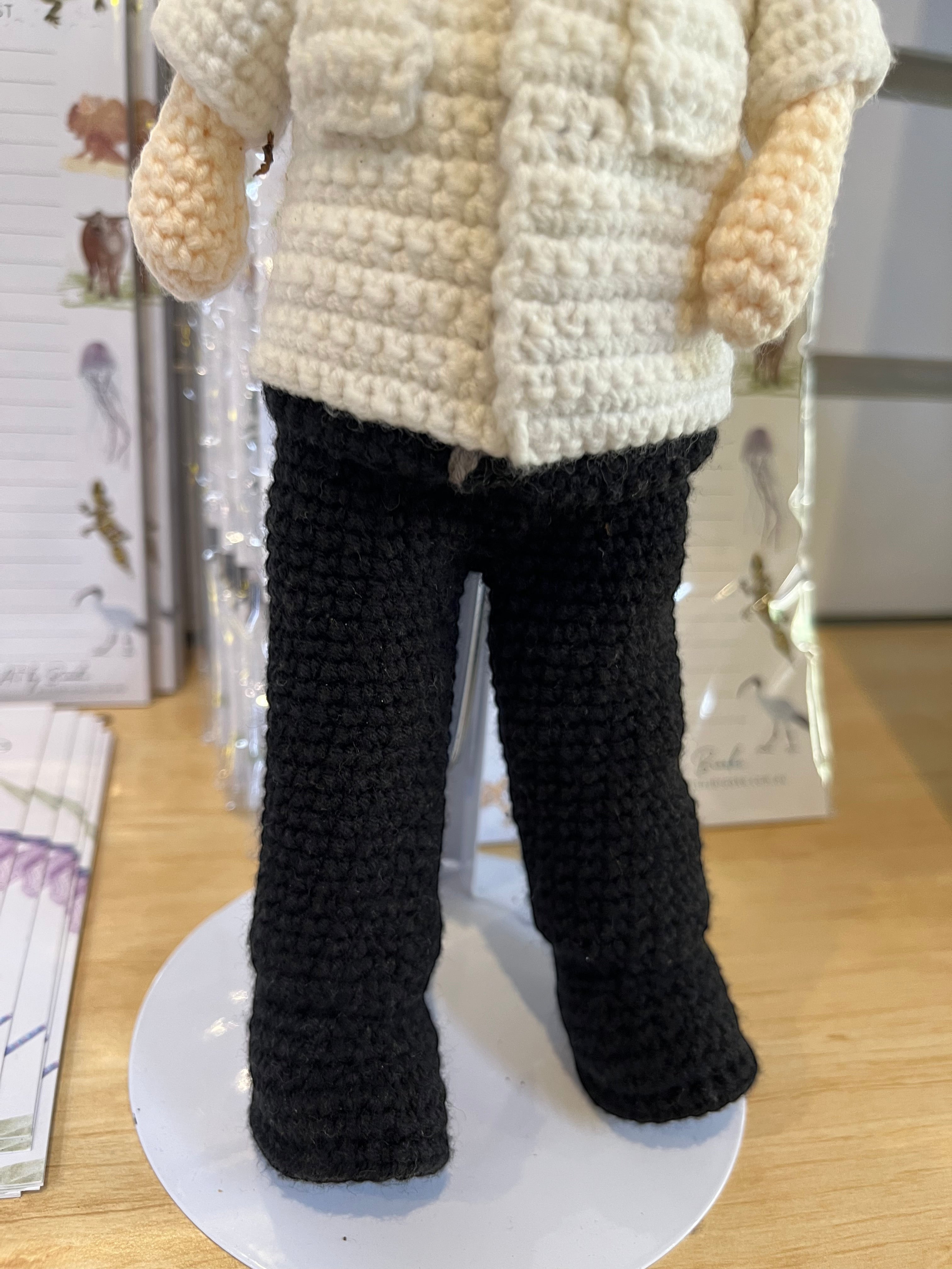 Suzie's Sunshine Dolls handmade crocheted pilot doll in uniform with white shirt and black pants.