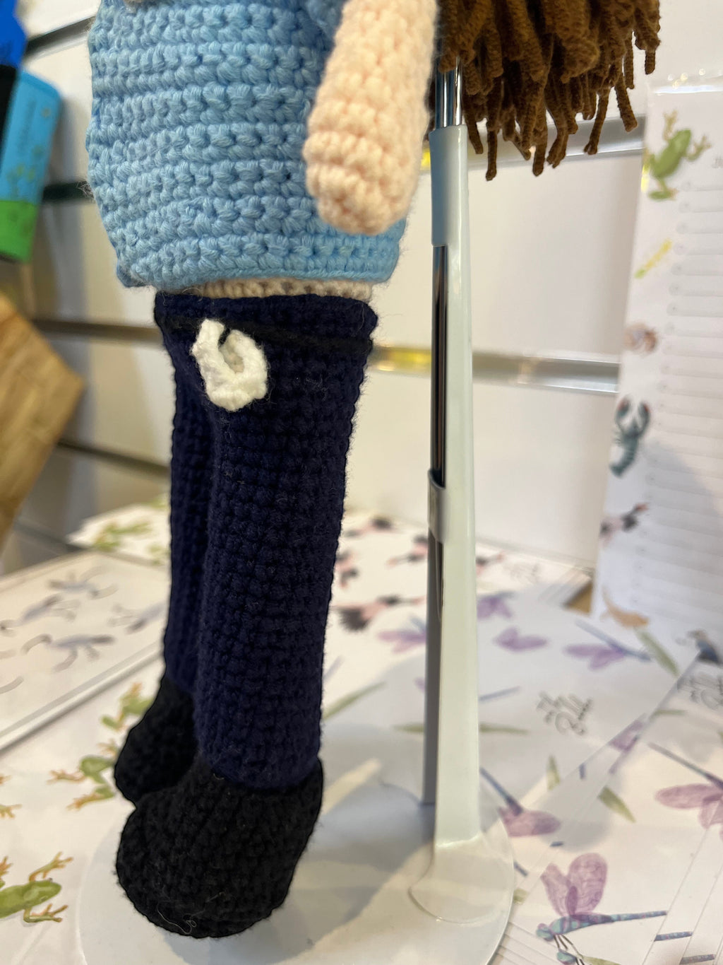 Suzie's Sunshine Dolls crocheted policeman doll in blue uniform with navy pants and black boots. Handmade.