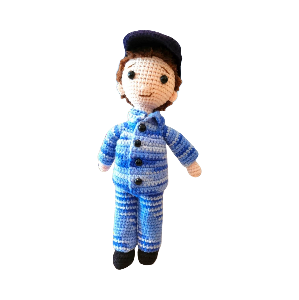 Suzie's Sunshine Dolls RAAF Personnel doll in blue camouflage uniform with cap, handmade from yarn.