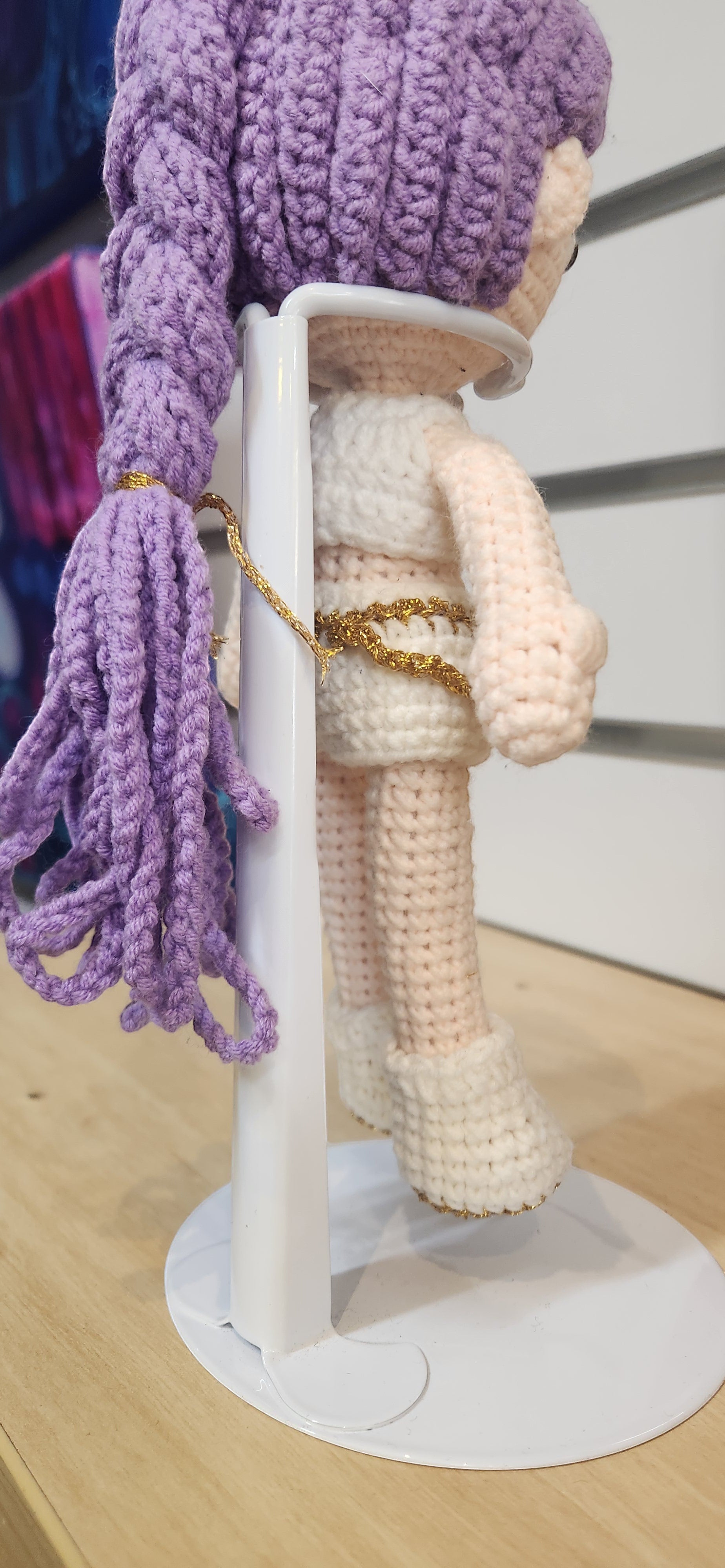 Suzie's Sunshine Dolls Rumi K-Pop Demon Hunter amigurumi doll with lilac hair and white outfit with gold trim.