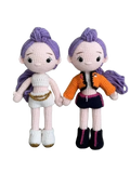 Suzie's Sunshine Dolls Rumi K-Pop Demon Hunter amigurumi doll with purple hair, one in white outfit, one in orange jacket and dark skirt.