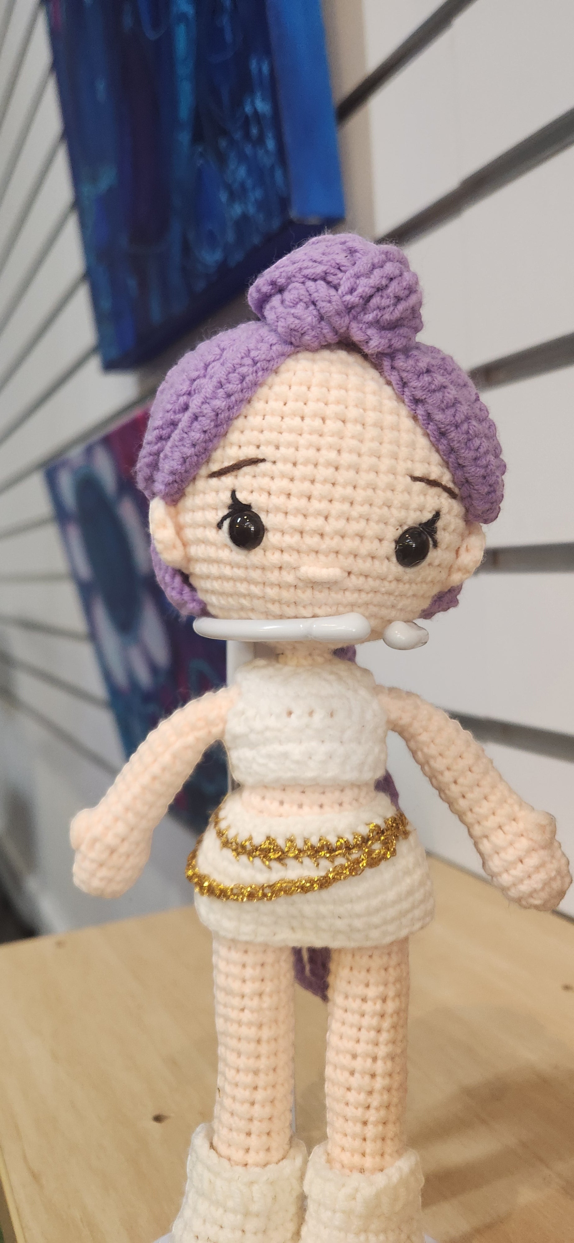 Suzie's Sunshine Dolls Rumi K-Pop Demon Hunter amigurumi doll with lilac hair, white outfit, and gold trim.