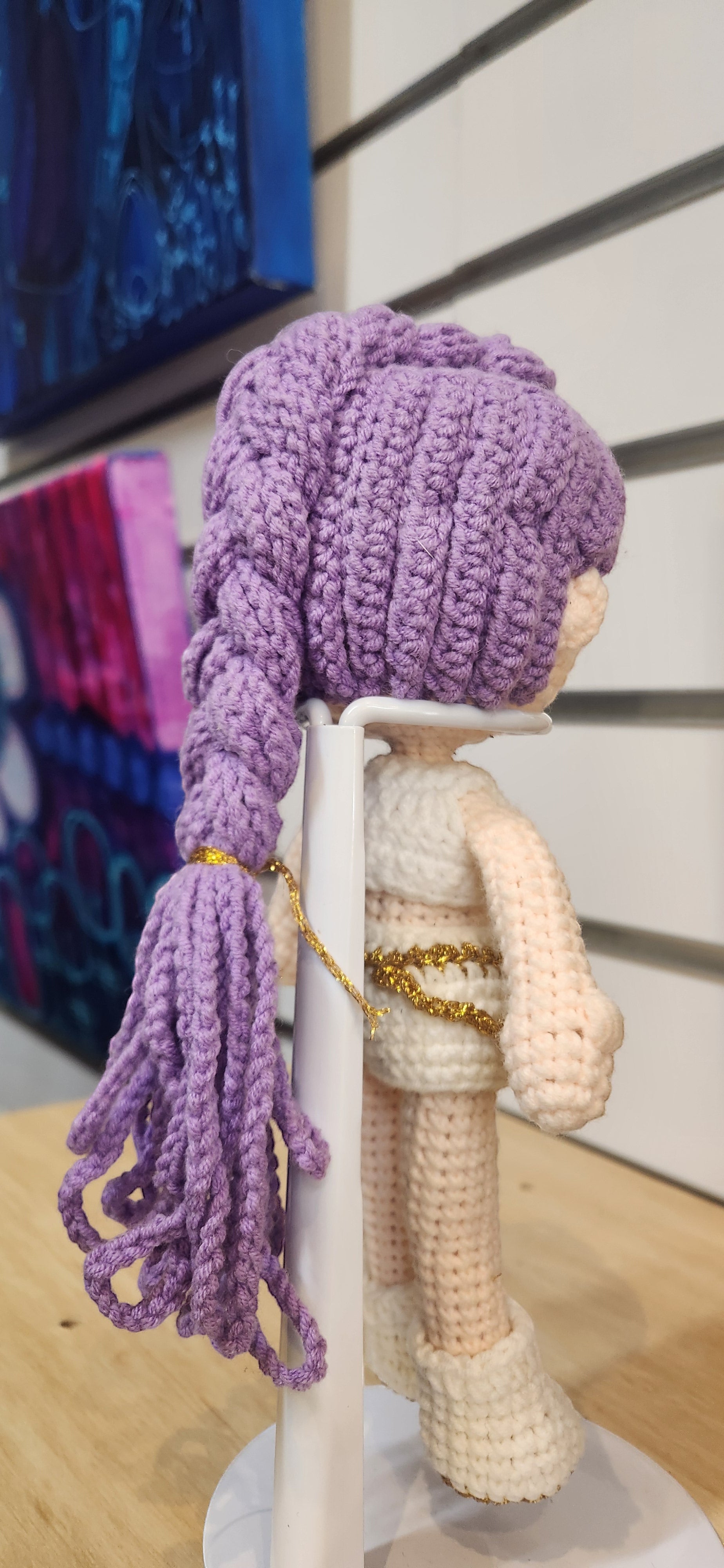 Suzie's Sunshine Dolls Rumi K-Pop Demon Hunter amigurumi doll with lilac hair and white outfit with gold trim.