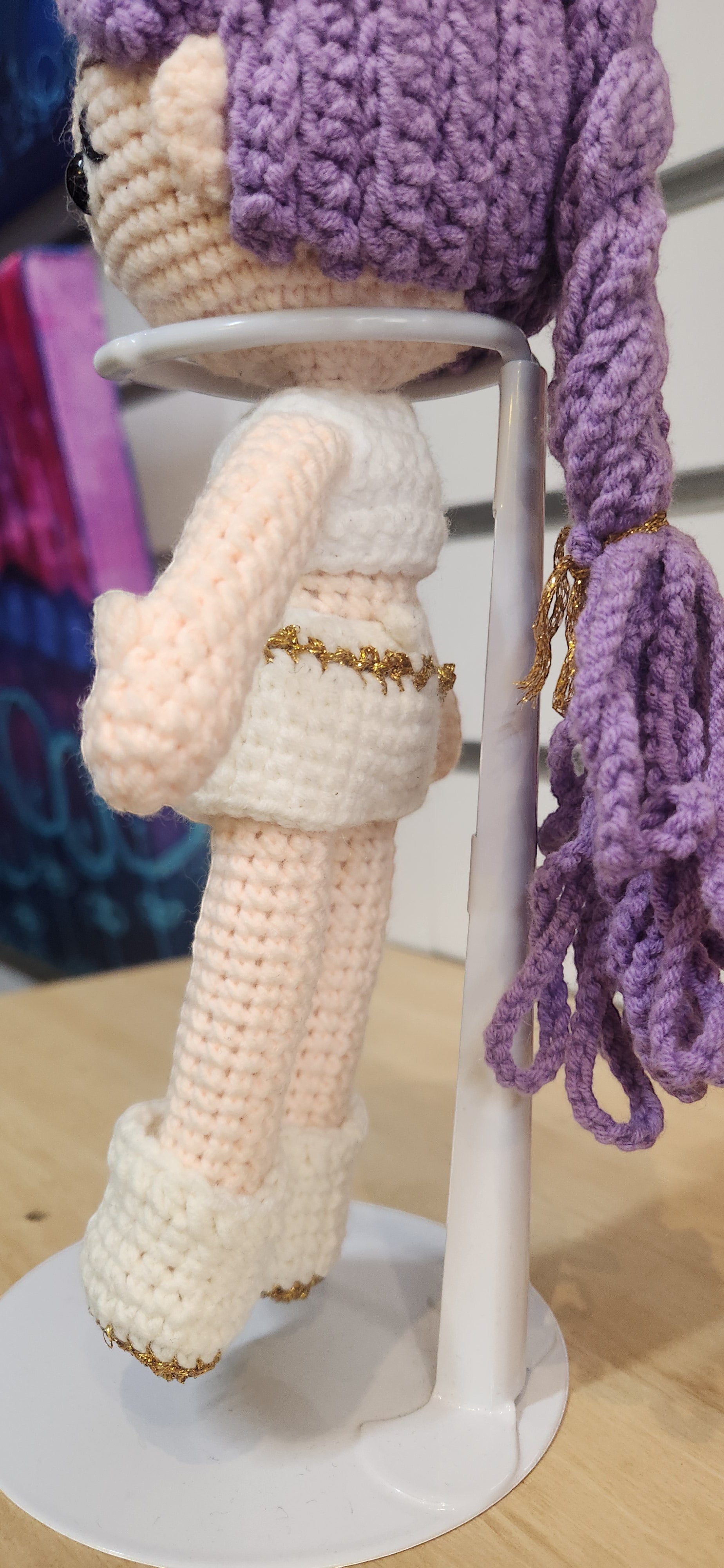 Suzie's Sunshine Dolls Rumi K-Pop Demon Hunter amigurumi doll with lilac hair and white outfit with gold trim.