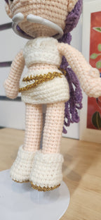 Suzie's Sunshine Dolls Rumi K-Pop Demon Hunter amigurumi doll in white outfit with gold trim and purple hair.